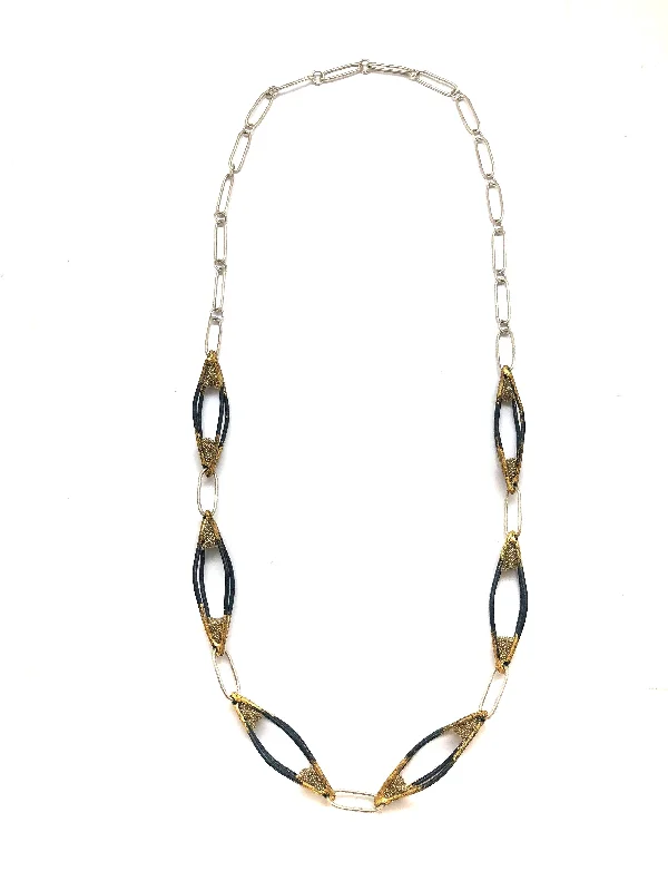 handcrafted turquoise necklace Black and Gold Cage Necklace