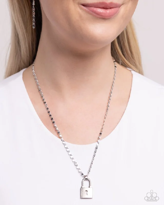 silver infinity knot ring Paparazzi Necklace ~ Locked Lesson - Silver